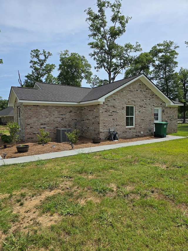 3524 Moss Island Ct, Albany, GA 31721 - view of side of property featuring brick siding, a yard, and central air condition unit