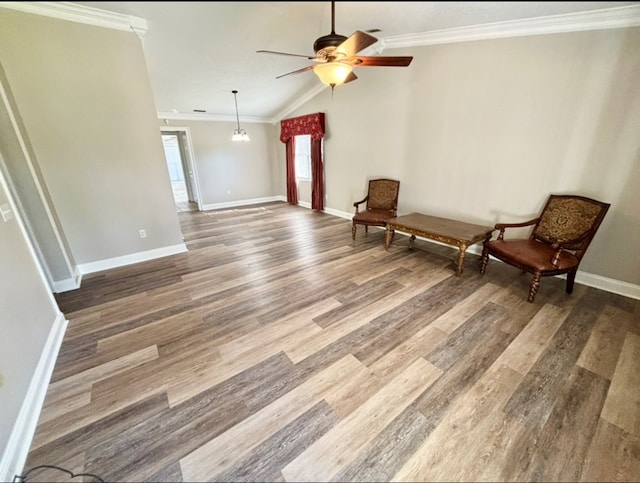 311 E 24th St, Tifton, GA 31794 - unfurnished room with baseboards, vaulted ceiling, ornamental molding, ceiling fan, and wood finished floors