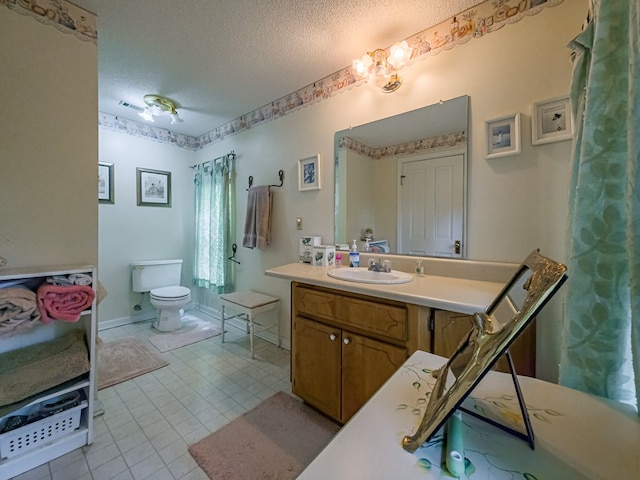 64 Palmetta Rd, Tifton, GA 31794 - bathroom featuring a textured ceiling, vanity, and tile patterned flooring
