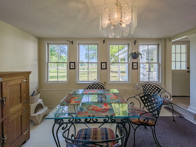64 Palmetta Rd, Tifton, GA 31794 - tiled dining space with a chandelier and a textured ceiling