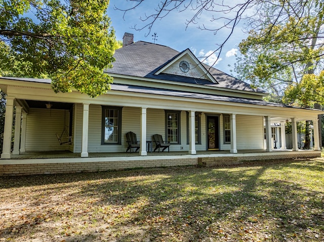 64 Palmetta Rd, Tifton, GA 31794 - farmhouse with a porch and a chimney