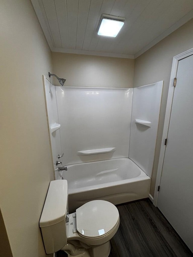 2019 N Central Ave, Tifton, GA 31794 - full bathroom with wood finished floors, toilet, and washtub / shower combination