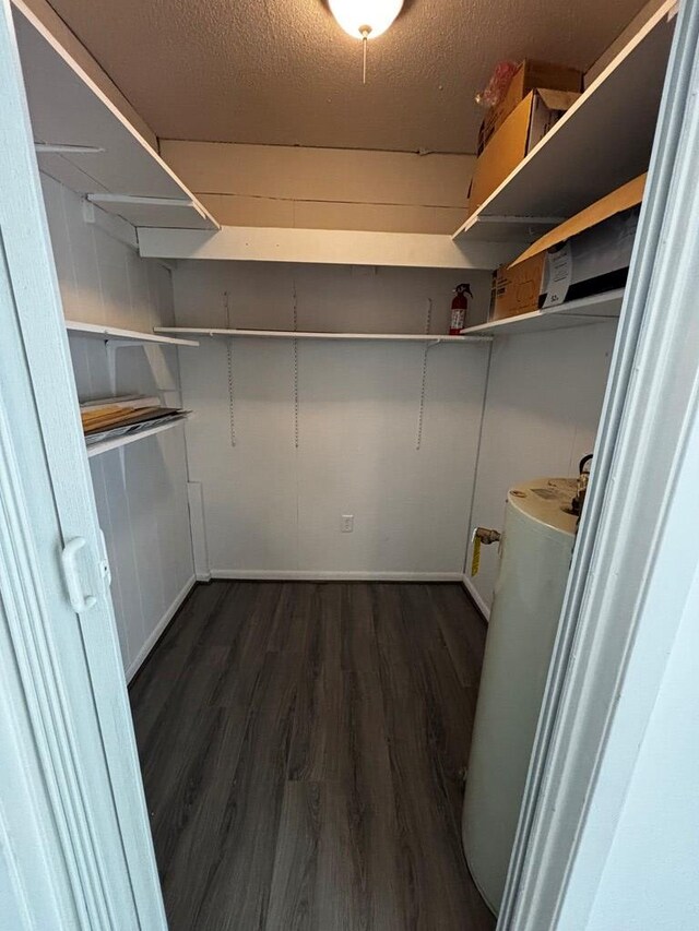2019 N Central Ave, Tifton, GA 31794 - walk in closet featuring wood finished floors and water heater