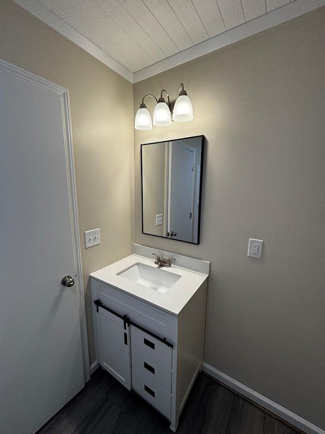 2019 N Central Ave, Tifton, GA 31794 - bathroom with wood finished floors, vanity, and baseboards