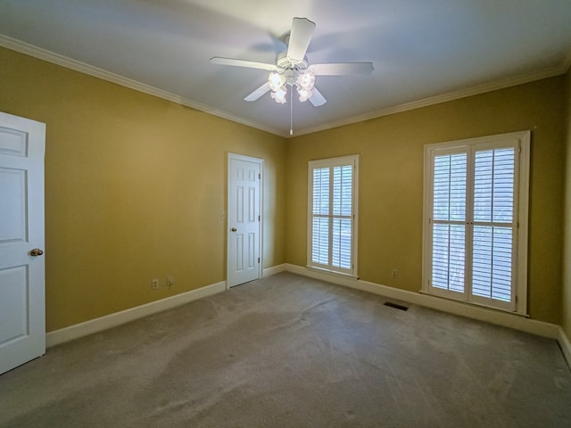 11 Fairway Dr, Tifton, GA 31793 - carpeted spare room with baseboards, ornamental molding, ceiling fan, and visible vents