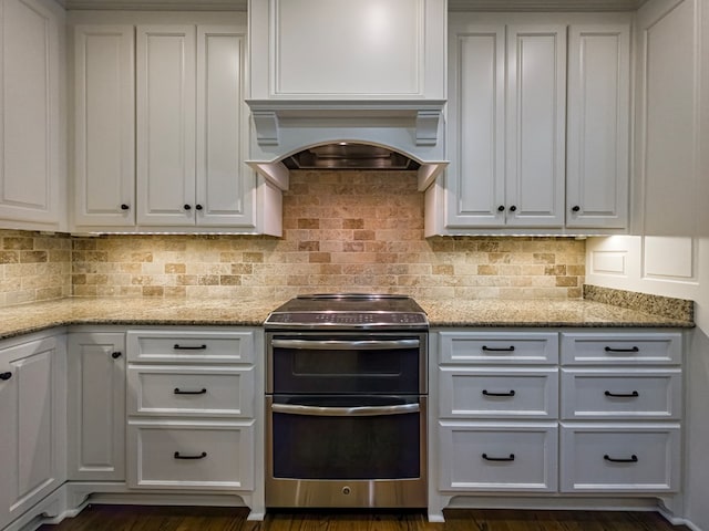 11 Fairway Dr, Tifton, GA 31793 - kitchen with appliances with stainless steel finishes, decorative backsplash, light stone countertops, and white cabinetry