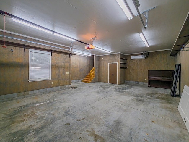 11 Fairway Dr, Tifton, GA 31793 - garage with a garage door opener and wooden walls