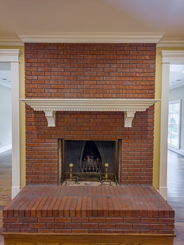 11 Fairway Dr, Tifton, GA 31793 - room details featuring crown molding, baseboards, a brick fireplace, and wood finished floors