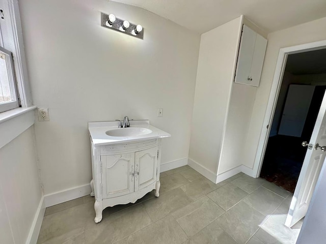 416 W 6th St, Tifton, GA 31794 - bathroom with tile patterned floors, baseboards, and vanity