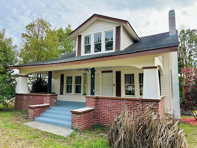 416 W 6th St, Tifton, GA 31794 - view of front of property with brick siding, a porch, a chimney, and a ceiling fan