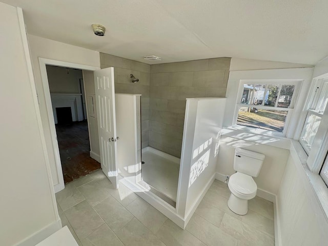 416 W 6th St, Tifton, GA 31794 - bathroom featuring toilet, tile patterned floors, a walk in shower, and baseboards