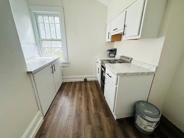 416 W 6th St, Tifton, GA 31794 - kitchen with stainless steel electric range oven, white cabinets, light countertops, baseboards, and dark wood-style floors