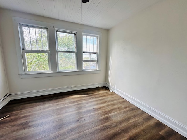 416 W 6th St, Tifton, GA 31794 - empty room with a ceiling fan, wooden ceiling, baseboards, and dark wood finished floors