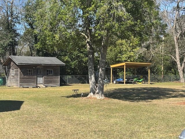 307 E Pinson St, Sylvester, GA 31791 - view of yard with fence, a detached carport, and an outbuilding