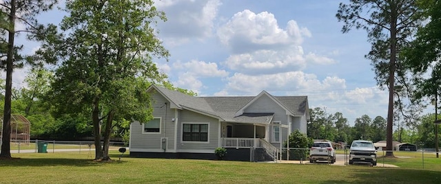 307 E Pinson St, Sylvester, GA 31791 - back of property with fence, a yard, a porch, and roof with shingles