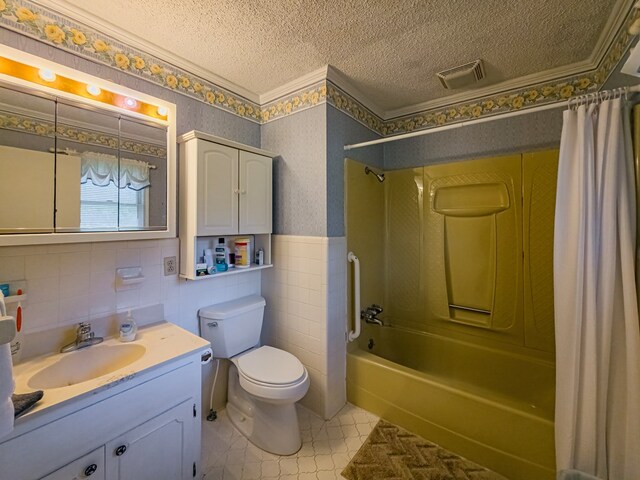 128 Airport Rd, Sylvester, GA 31791 - full bathroom with tile walls, a textured ceiling, wallpapered walls, shower / bathtub combination with curtain, and vanity