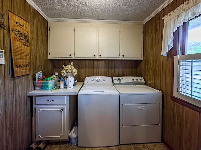 128 Airport Rd, Sylvester, GA 31791 - laundry room featuring cabinet space, washer and dryer, a textured ceiling, crown molding, and wood walls