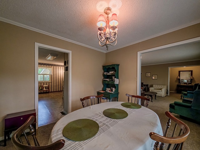 128 Airport Rd, Sylvester, GA 31791 - carpeted dining area with a chandelier, ornamental molding, a textured ceiling, and baseboards