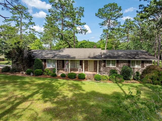 128 Airport Rd, Sylvester, GA 31791 - single story home with a front lawn, covered porch, and brick siding