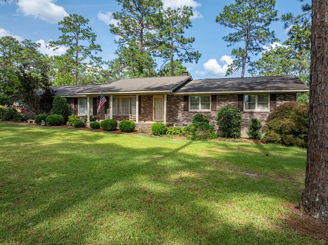 128 Airport Rd, Sylvester, GA 31791 - ranch-style house featuring a front yard and brick siding