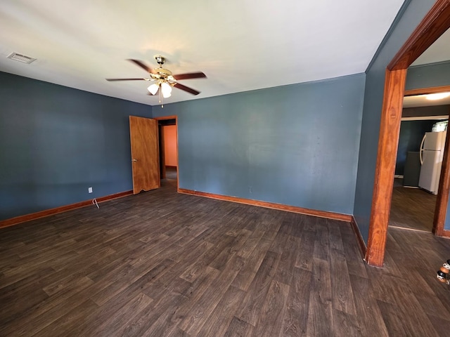 105 Gaff Ave, Fitzgerald, GA 31750 - empty room featuring dark wood finished floors, visible vents, baseboards, and a ceiling fan