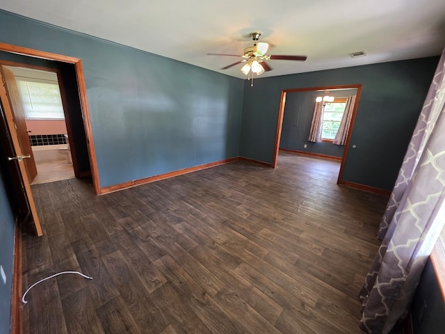 105 Gaff Ave, Fitzgerald, GA 31750 - empty room with visible vents, baseboards, ceiling fan, and dark wood-style floors