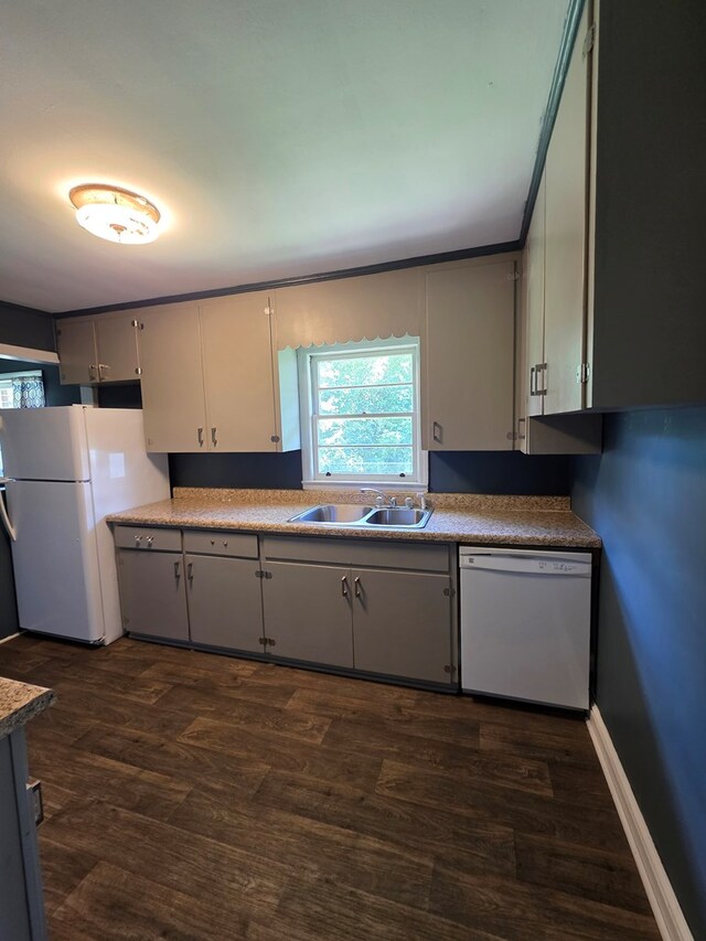 105 Gaff Ave, Fitzgerald, GA 31750 - kitchen featuring dark wood finished floors, gray cabinets, a sink, and white appliances