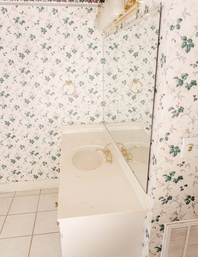 145 Bell Rd, Sylvester, GA 31791 - bathroom featuring wallpapered walls, vanity, baseboards, and tile patterned flooring