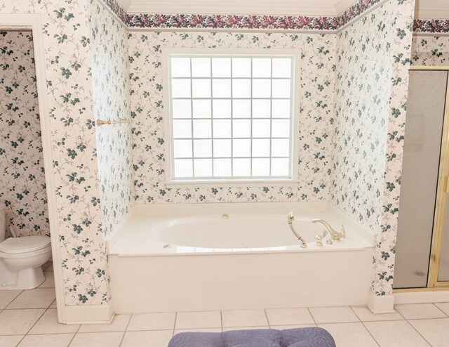 145 Bell Rd, Sylvester, GA 31791 - bathroom featuring tile patterned flooring, a stall shower, wallpapered walls, and toilet