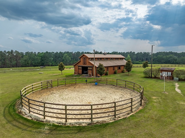 248 Gun Lake Loop, Tifton, GA 31794 - view of grassy yard featuring an outdoor structure, an outdoor riding arena, a garage, a view of rural / pastoral area, and driveway