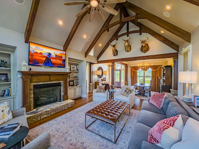 248 Gun Lake Loop, Tifton, GA 31794 - living room with a chandelier, beamed ceiling, wood finished floors, ceiling fan, and a fireplace