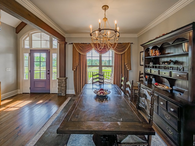248 Gun Lake Loop, Tifton, GA 31794 - dining room with a chandelier, wood finished floors, crown molding, and decorative columns