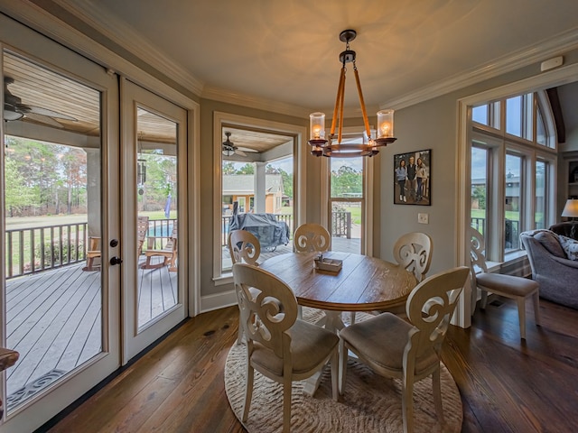 248 Gun Lake Loop, Tifton, GA 31794 - dining space featuring dark wood-type flooring, a chandelier, french doors, ornamental molding, and a ceiling fan