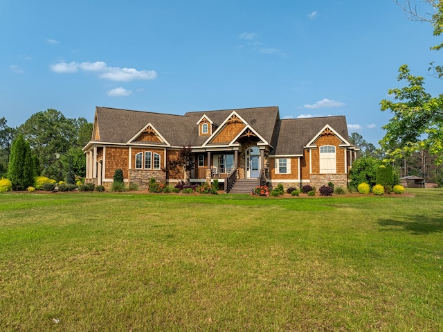 248 Gun Lake Loop, Tifton, GA 31794 - craftsman inspired home with a porch, stone siding, a front lawn, and roof with shingles
