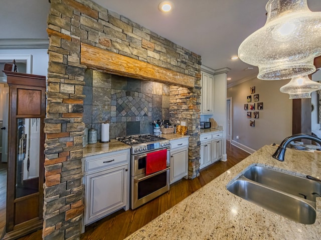 248 Gun Lake Loop, Tifton, GA 31794 - kitchen with range with two ovens, dark wood-style floors, decorative backsplash, light stone countertops, and crown molding