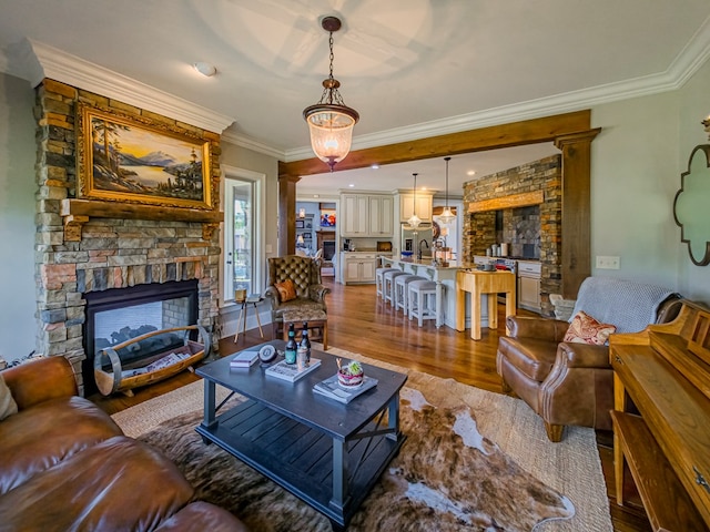 248 Gun Lake Loop, Tifton, GA 31794 - living area with a fireplace, wood finished floors, and ornamental molding