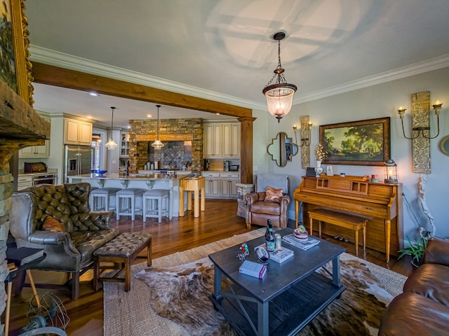 248 Gun Lake Loop, Tifton, GA 31794 - living area featuring dark wood finished floors, crown molding, and a chandelier