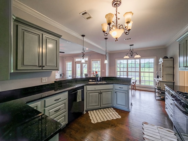 202 Ausby Rd, Oakfield, GA 31772 - kitchen with black appliances, a sink, a chandelier, a peninsula, and dark wood finished floors