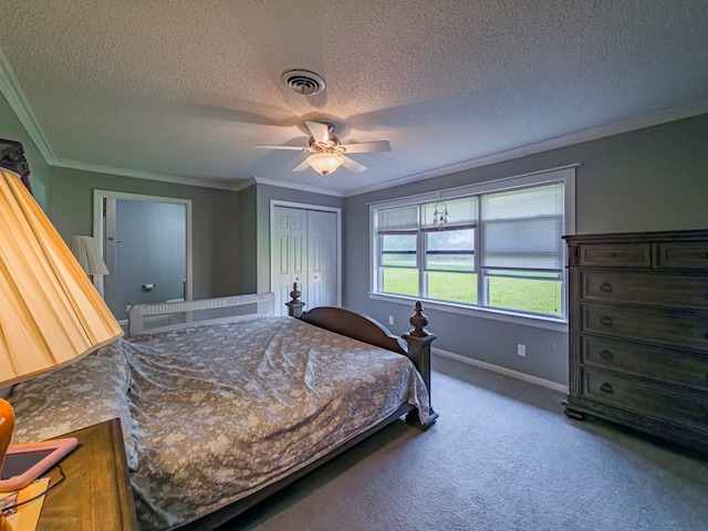 86 Owen Medford Rd, Lenox, GA 31637 - carpeted bedroom with a closet, ornamental molding, a textured ceiling, visible vents, and a ceiling fan