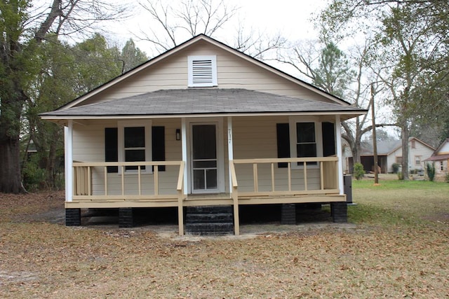 717 S College Ave, Tifton, GA 31794 - view of front of house with a shingled roof and a porch