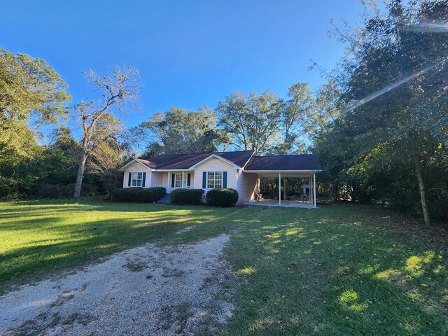 115 Easy St, Fitzgerald, GA 31750 - view of front of house with a front yard, an attached carport, and driveway