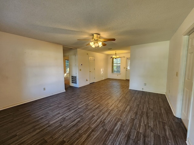 115 Easy St, Fitzgerald, GA 31750 - unfurnished room with baseboards, dark wood-style floors, ceiling fan with notable chandelier, and a textured ceiling