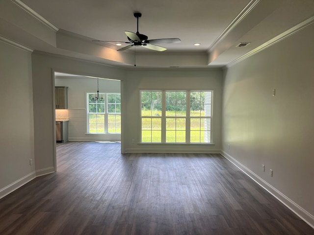 unfurnished living room featuring baseboards, crown molding, dark wood-style floors, and a raised ceiling