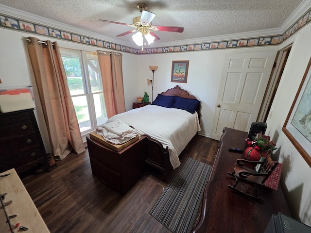 bedroom featuring a textured ceiling, dark wood finished floors, ornamental molding, and a ceiling fan