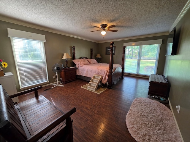 bedroom with crown molding, a textured ceiling, wood finished floors, and a ceiling fan
