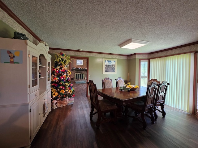 dining area featuring a textured ceiling, dark wood-type flooring, and crown molding