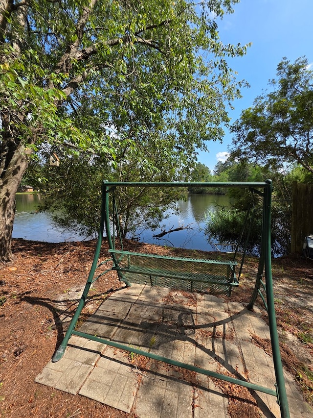 view of playground with a water view