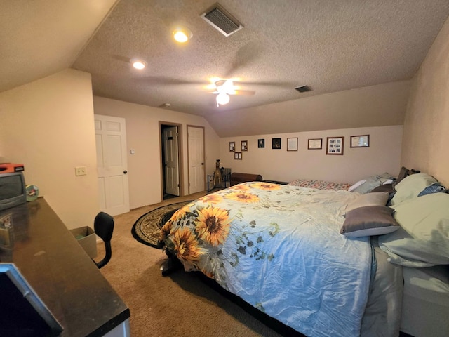 bedroom with lofted ceiling, carpet, ceiling fan, and a textured ceiling