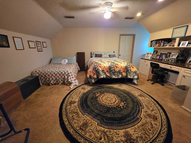 bedroom with carpet floors, lofted ceiling, a textured ceiling, an office area, and ceiling fan