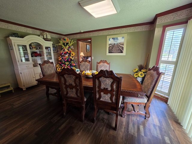 dining area featuring a textured ceiling, dark wood-style flooring, and crown molding